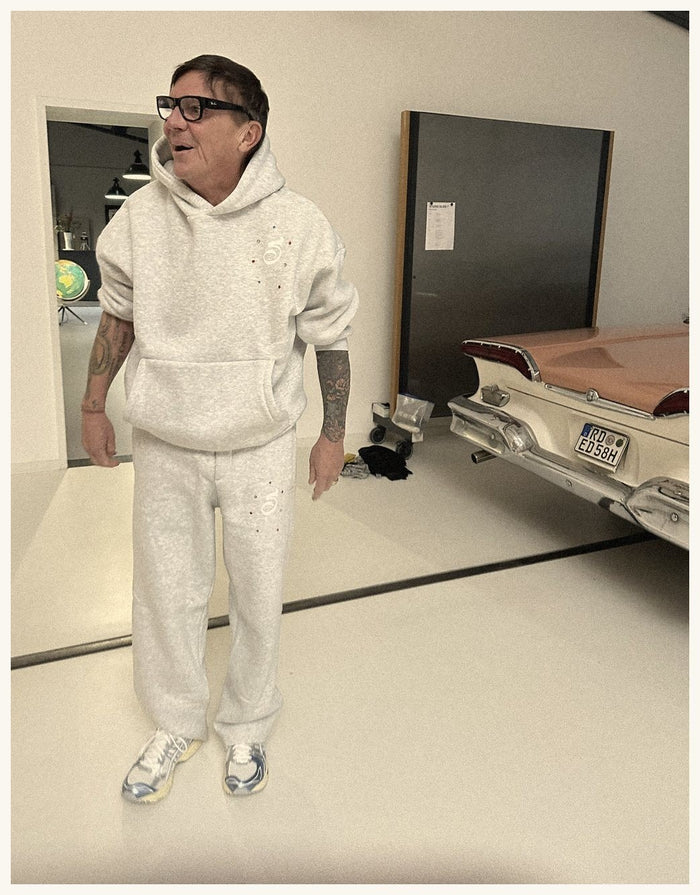 Grey, and laughing about it.